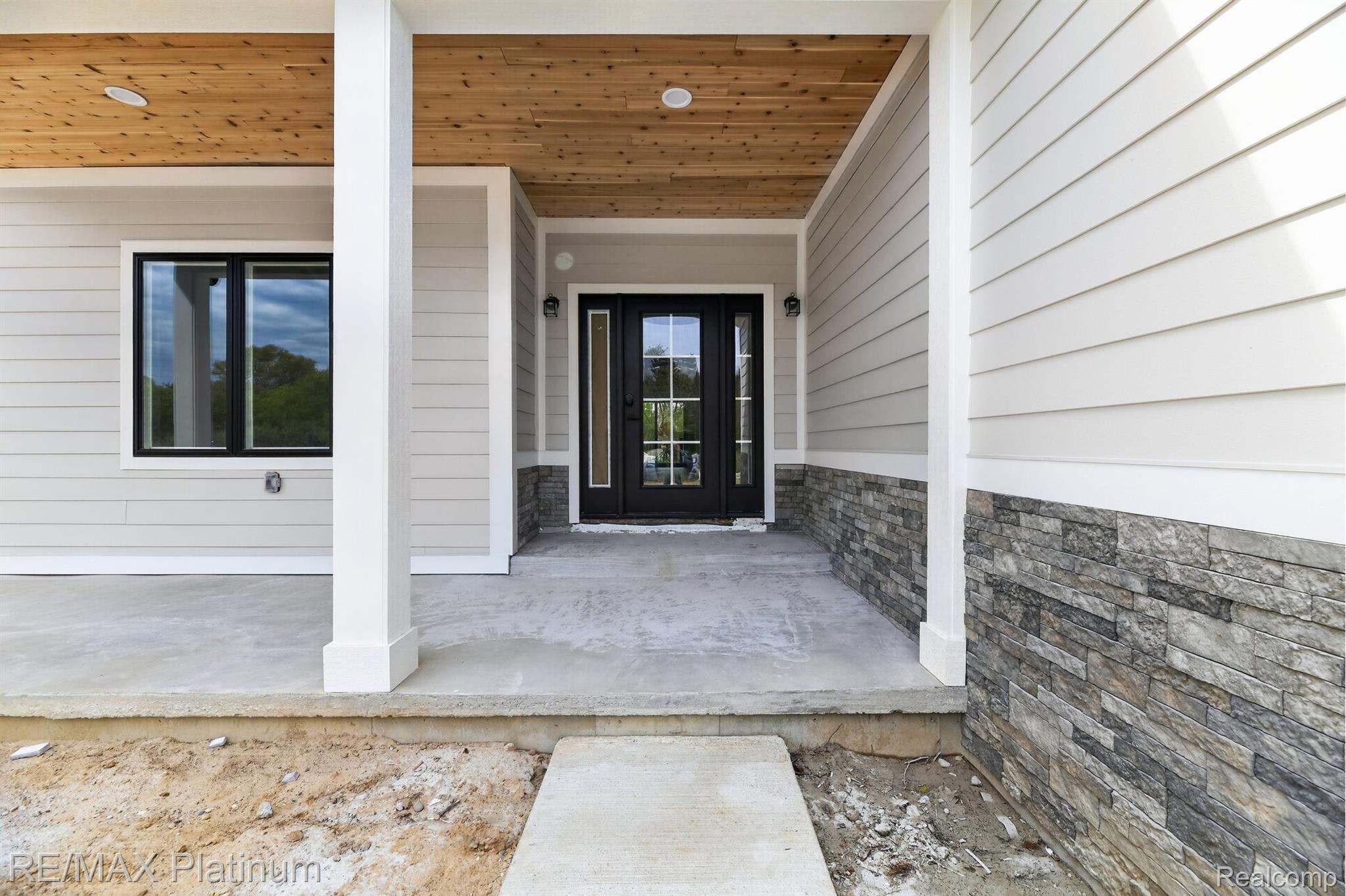 Covered front porch with wood ceiling